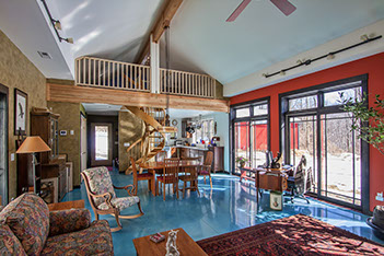 Picture of Green custom home built from SIPS panels showing polished concrete floor and vaulted ceiling